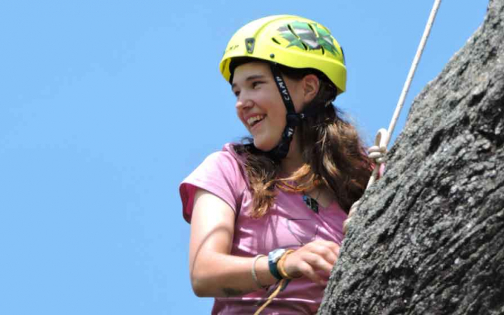 students succeed on rock climbing course